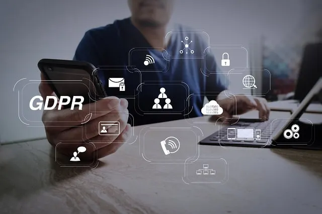 GDPR and privacy icons overlaid on image of person using smartphone and laptop