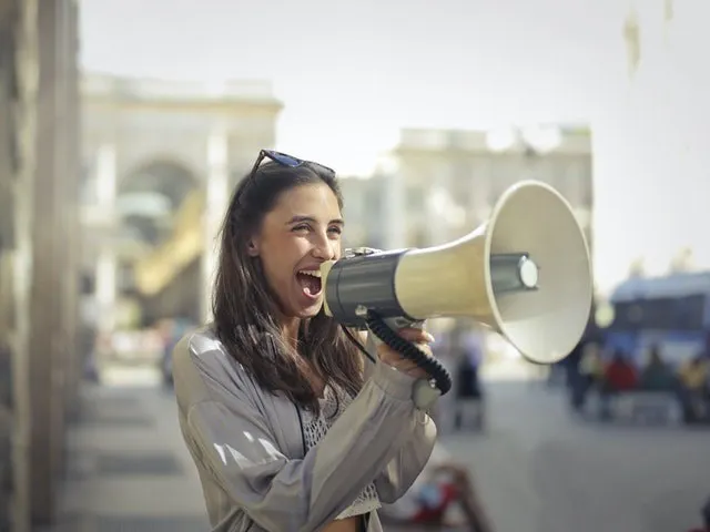 Woman with a megaphone outdoors