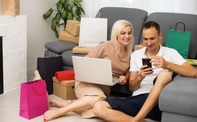 Couple shopping online on a laptop