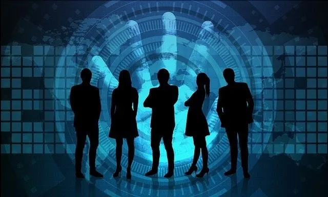 Anonymous silhouettes in front of a handprint and map graphic (data privacy concept)