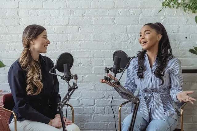 Podcast hosts having a conversation on the air